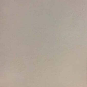 Leather rug, light beige, smooth texture, studio shot, matte finish, neutral background, rectangular shape, fine grain, understated design.